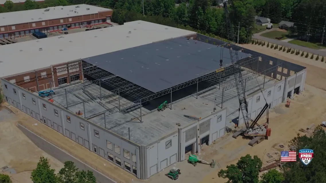 Aerial view of a commercial building's steel frame under construction