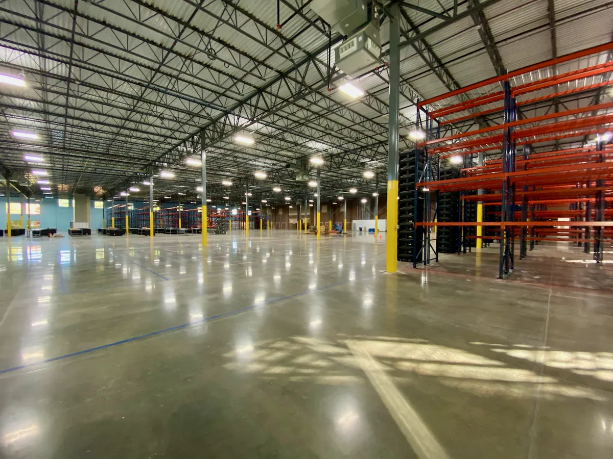 Interior of a large warehouse facility with polished concrete floor